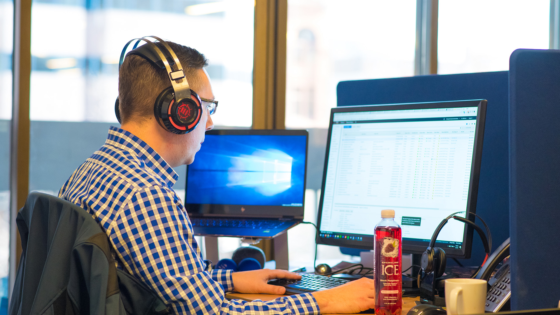 Colleague writing code on a computer